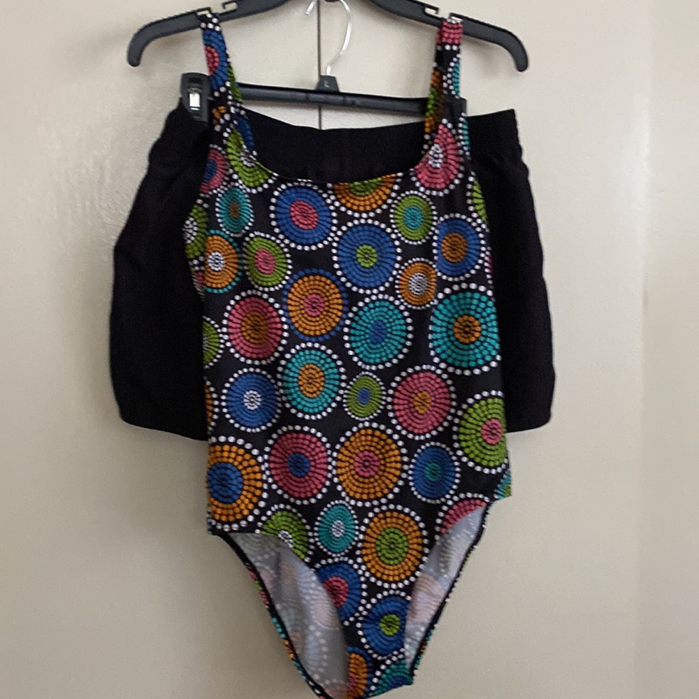 One piece piece swim suit with swim trunks